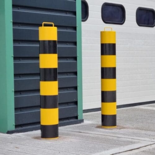 Steel anti ram bollards protecting the front entrance of a building